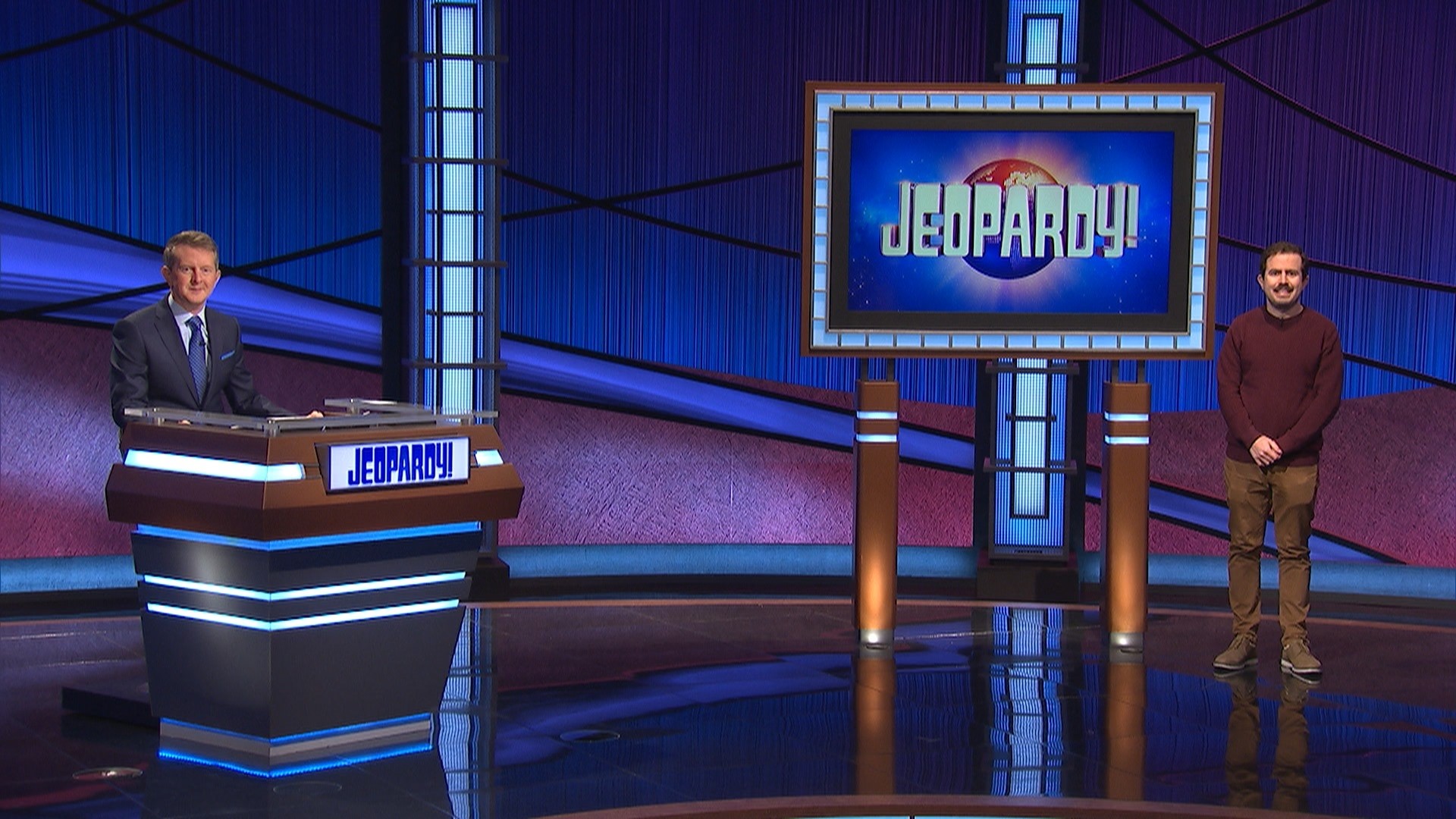 Mountain Lakes Alumnus Phil Hoffman on the set of Jeopardy! with host Ken Jennings.